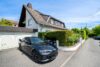 Modernisiertes, freistehendes EFH mit bis zu 3 ELW - Mehrgenerationenwohnen in Nieder-Eschbach - Außenansicht - Garage